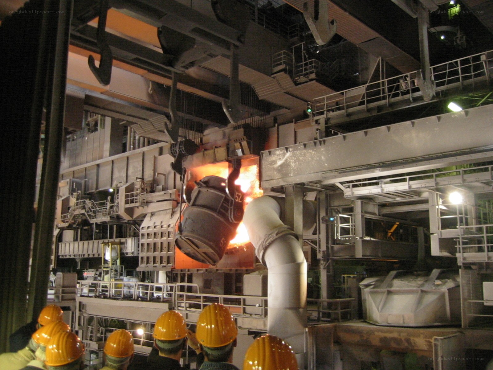 Workers at a steel mill