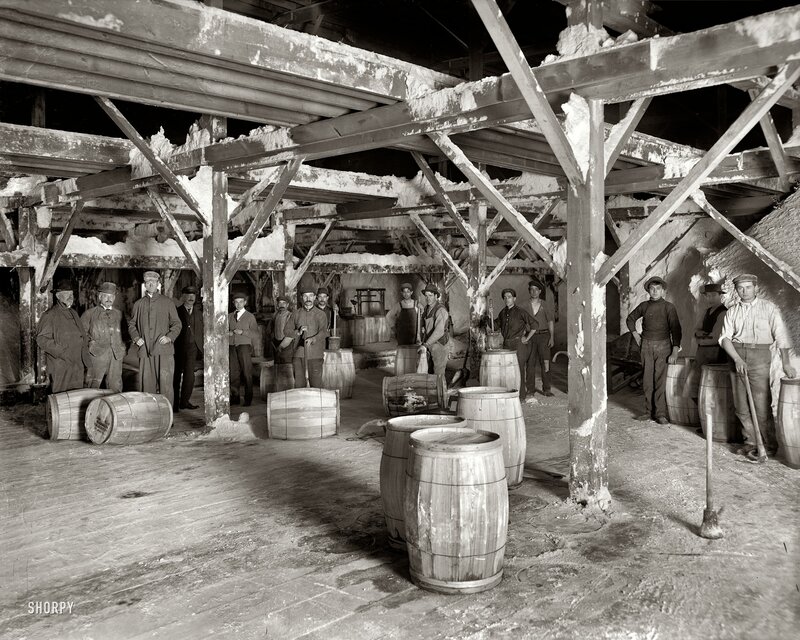 Workers in a barrel storage room