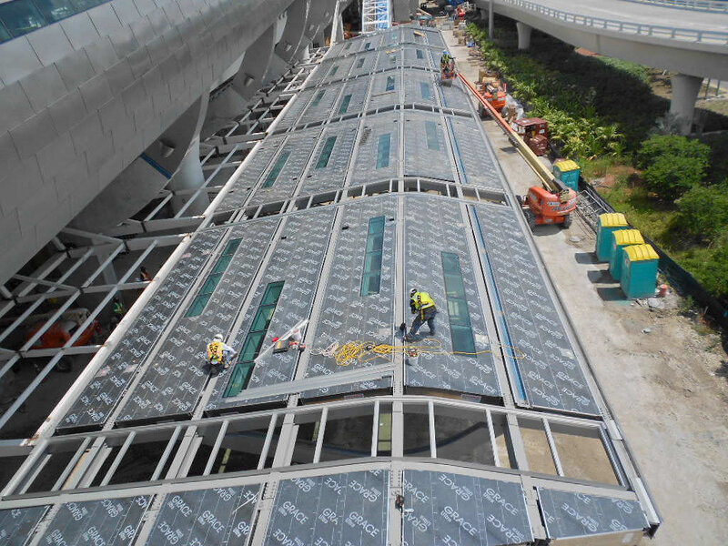 Workers Installing Roof Panels