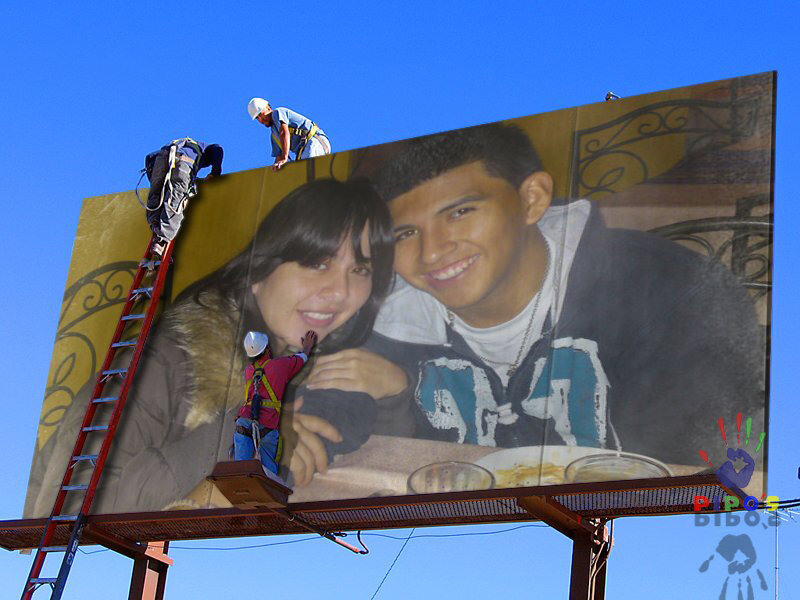 Workers on a billboard
