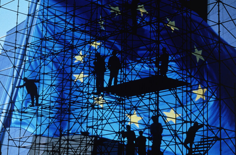 Workers on scaffolding with EU flag