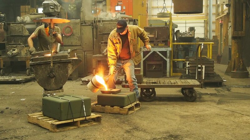 Workers Pouring Molten Metal