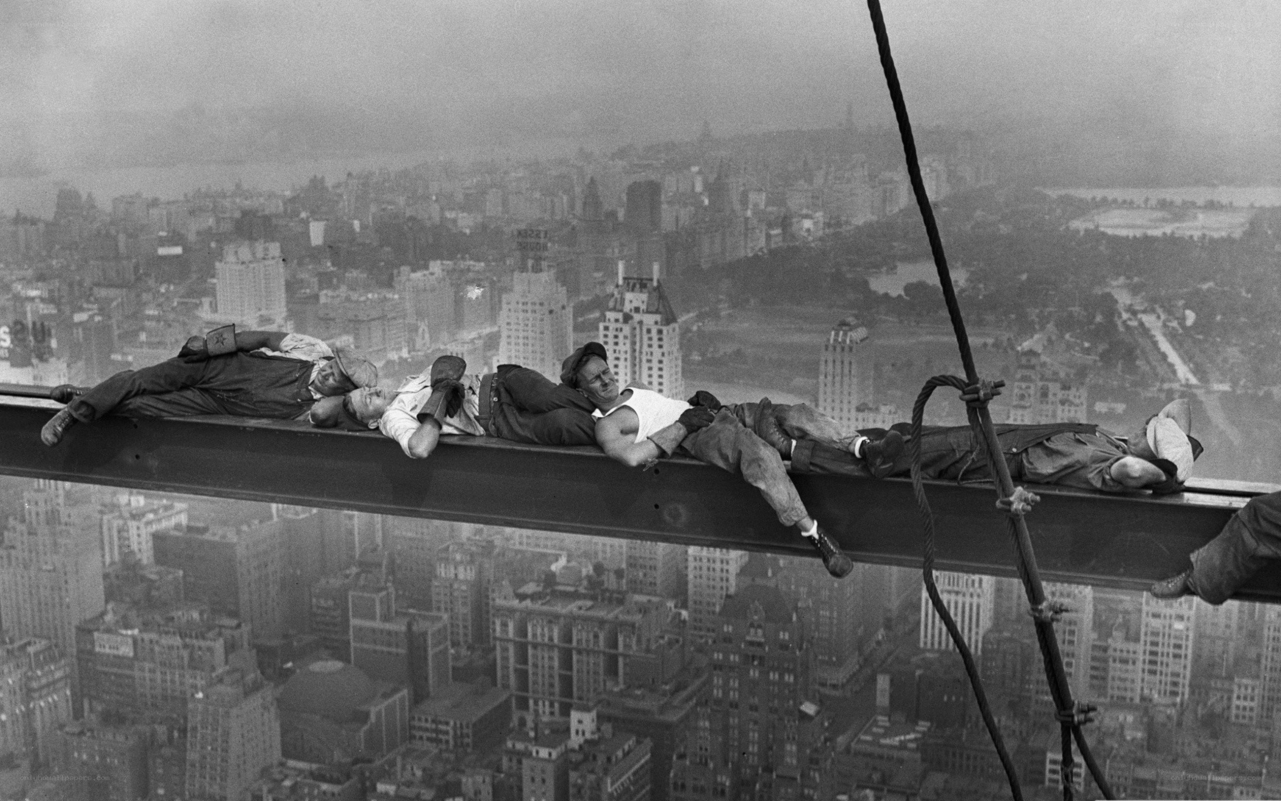Workers resting on steel beam