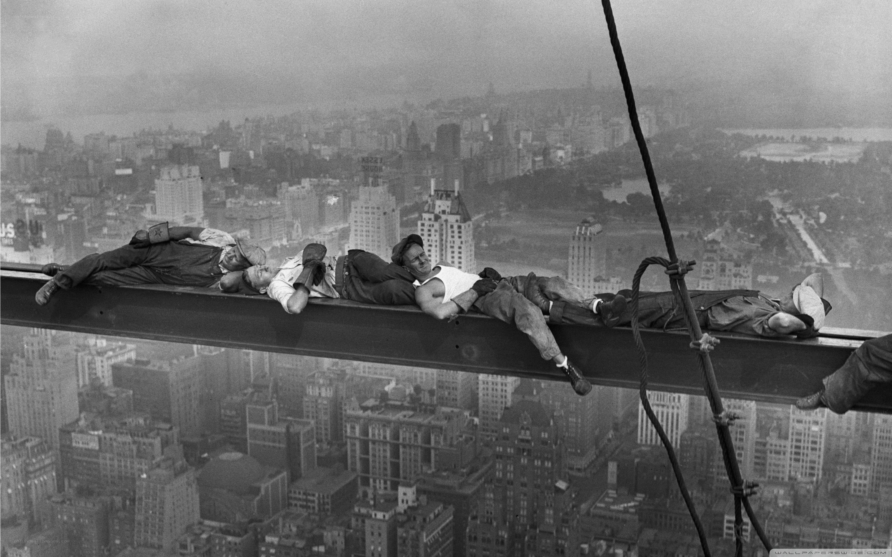 Workers resting on steel beam