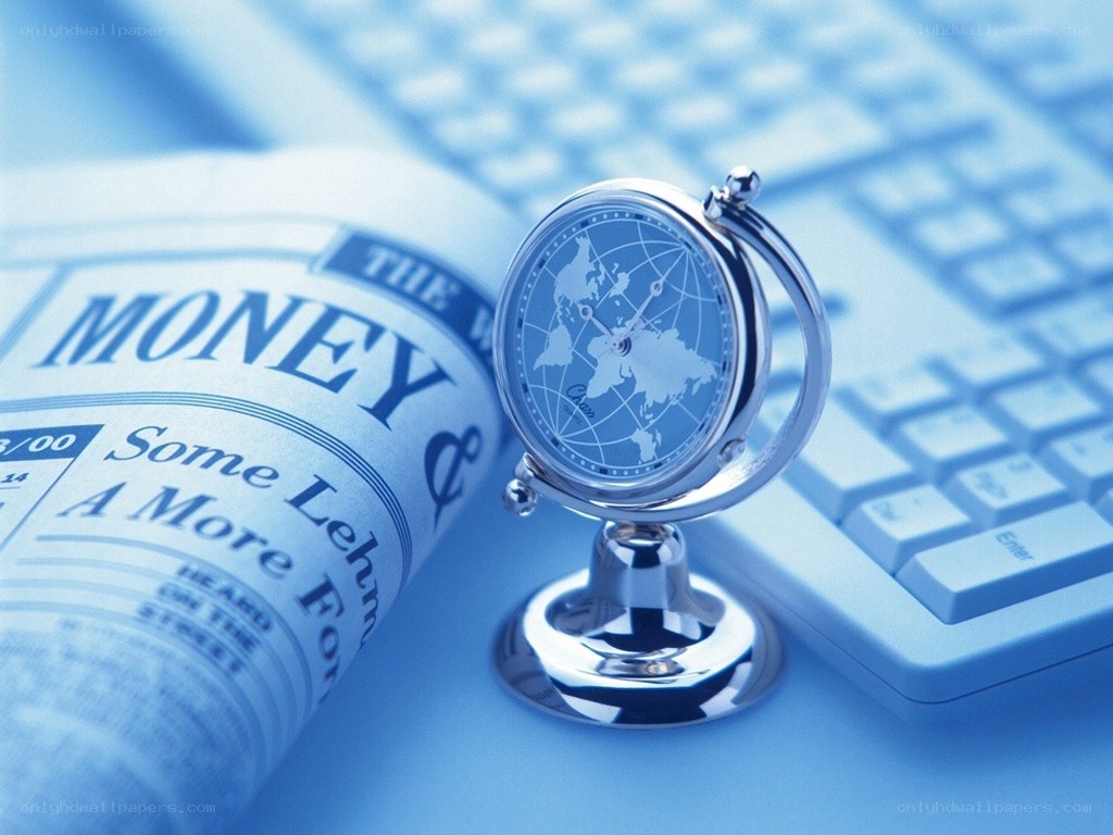 World clock on newspaper and keyboard