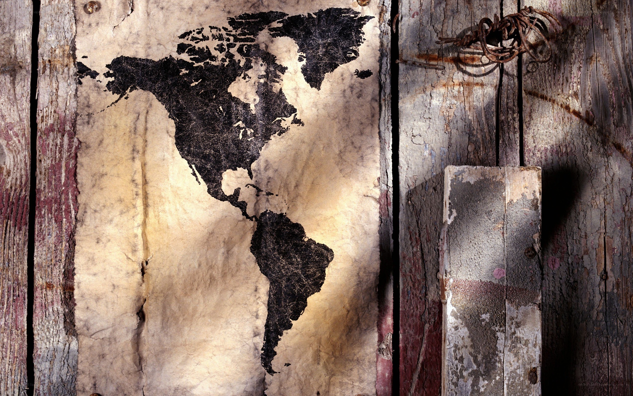 world map on weathered wood