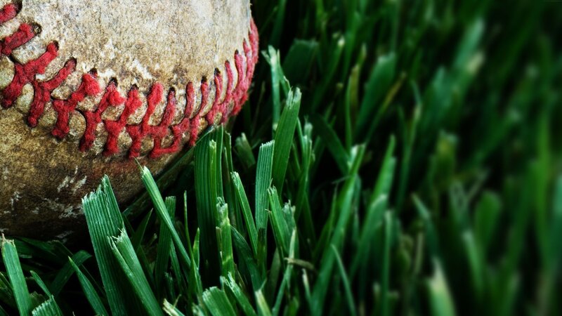 Worn Baseball on Grass