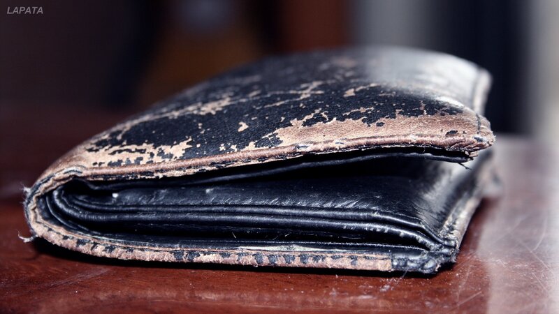 worn black leather wallet