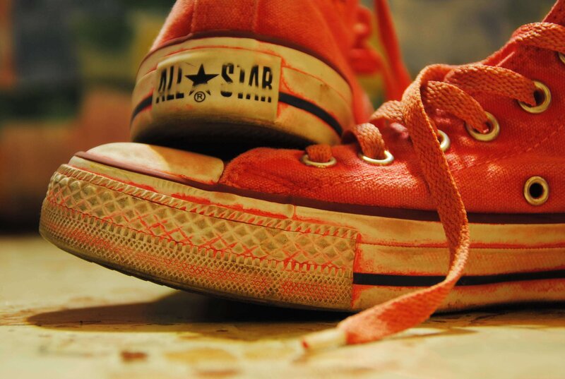 worn red converse sneakers