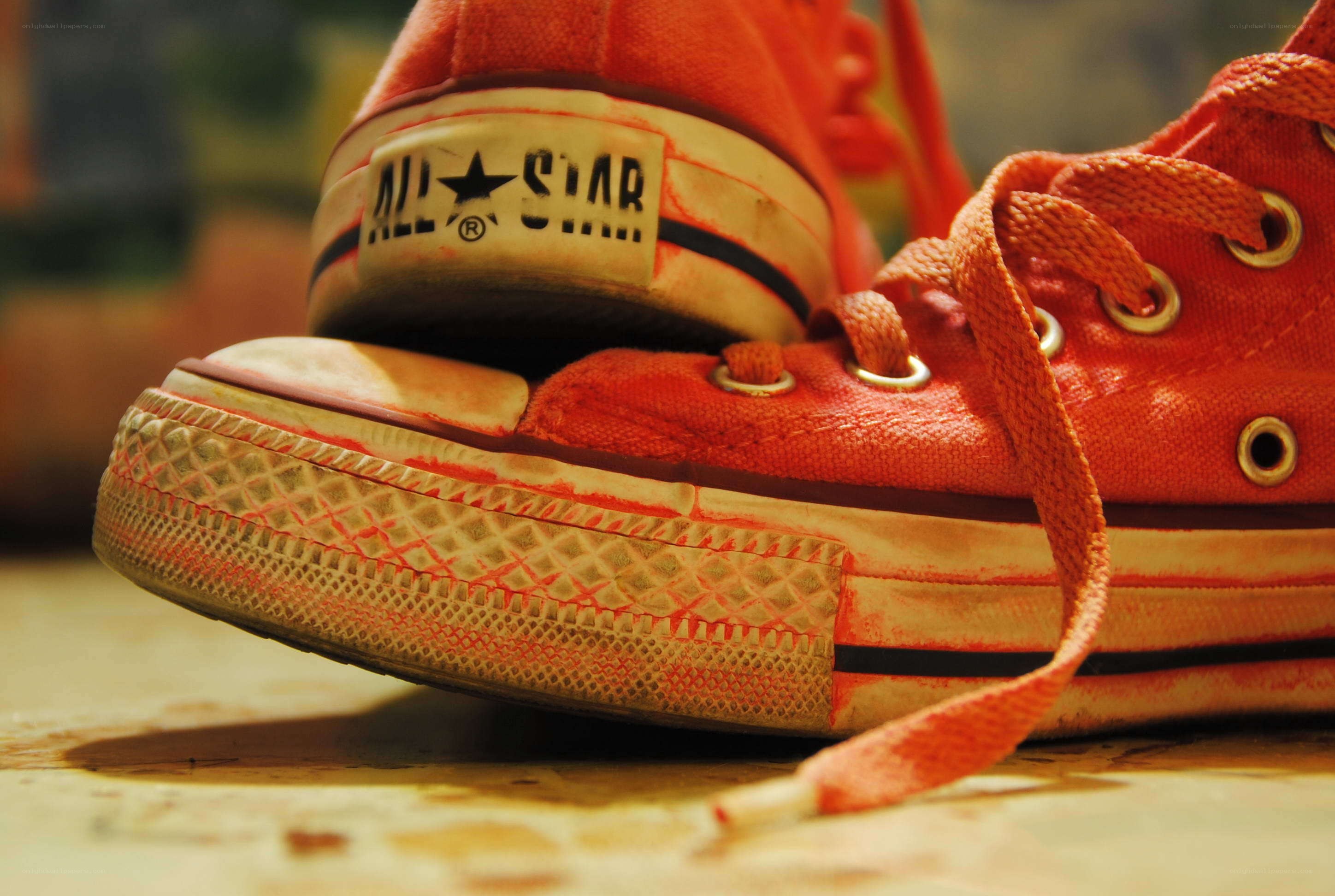 worn red converse sneakers