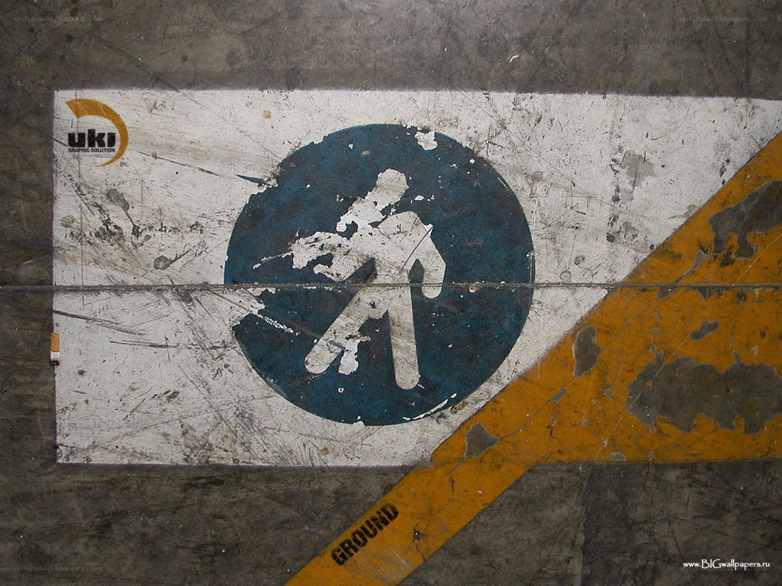 worn safety sign on concrete