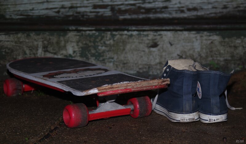 Worn Skateboard and Shoes