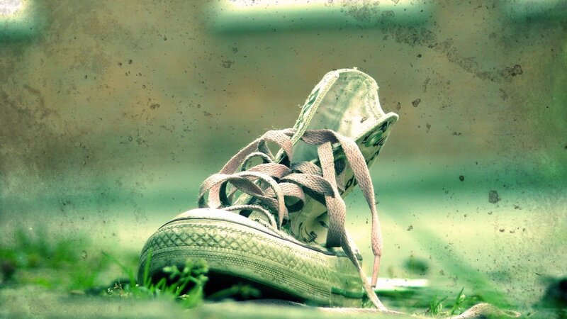 Worn Sneaker on Grass