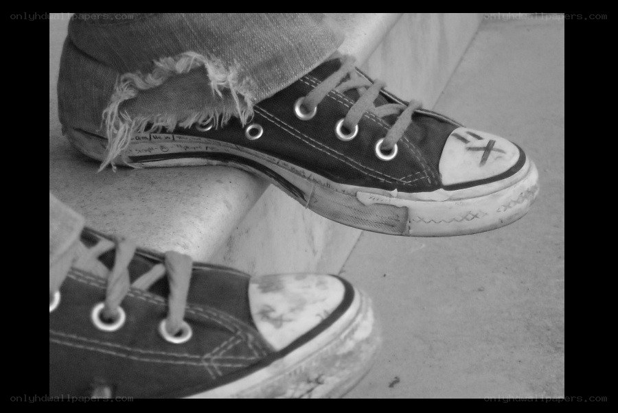 worn sneakers on steps