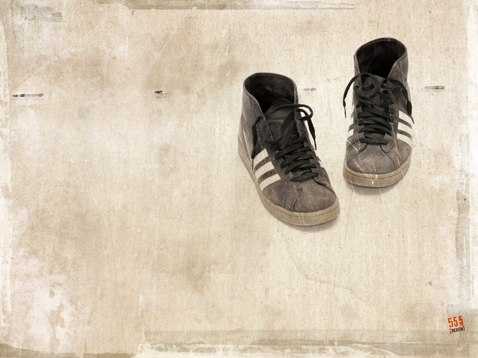 worn sneakers on textured background