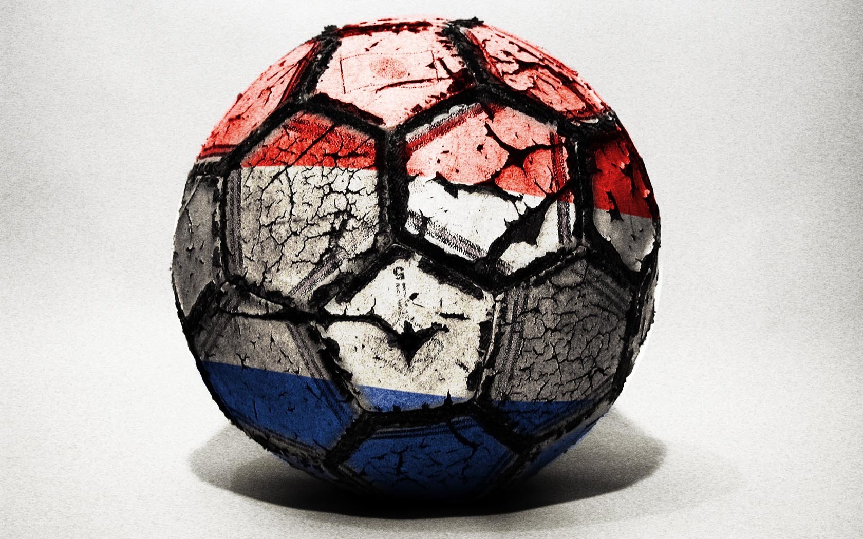 worn soccer ball with flag design