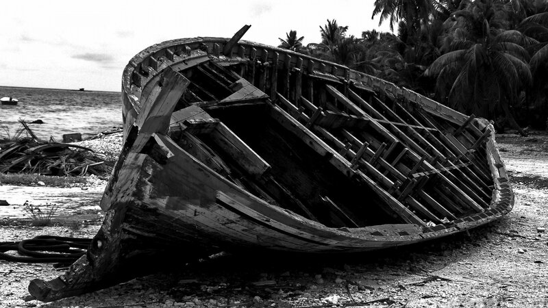 wrecked boat on tropical shore