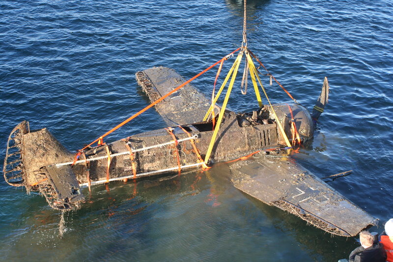 Wrecked plane being lifted from water