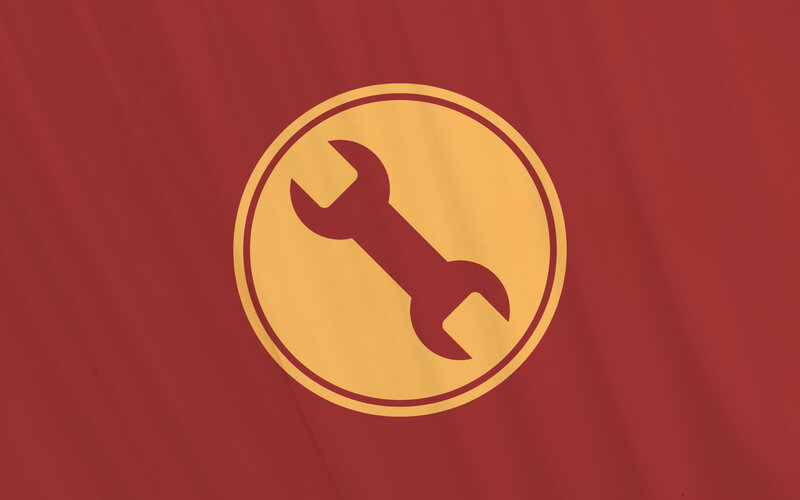 wrench icon on red fabric