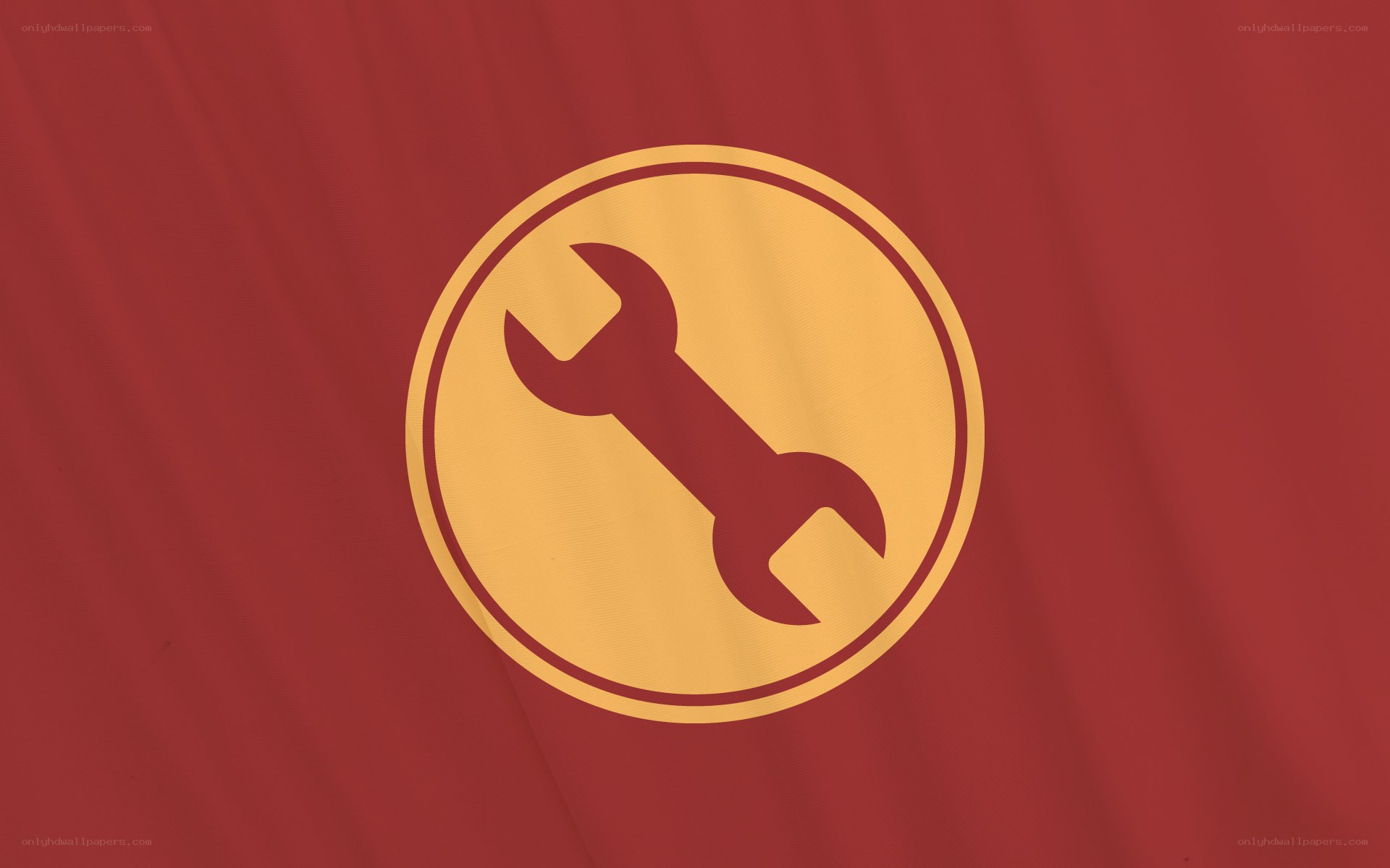 wrench icon on red fabric
