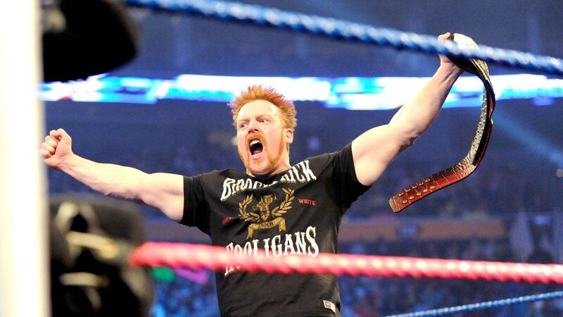 Wrestler holding championship belt