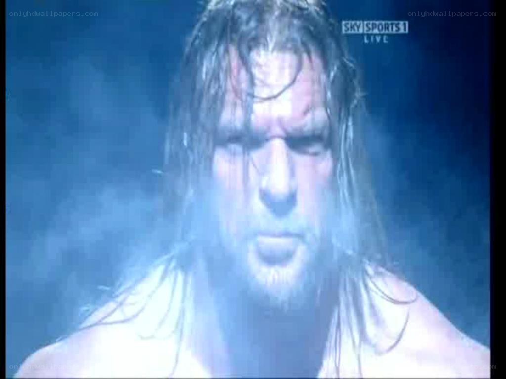 wrestler in blue smoke