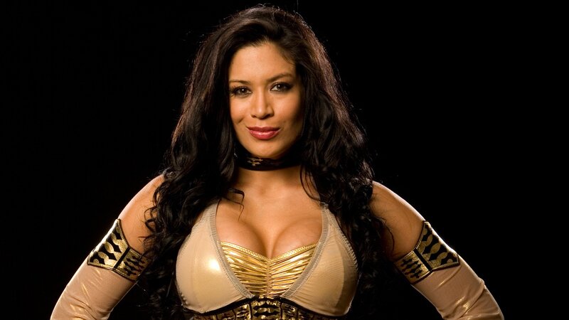 Wrestler in gold and beige outfit