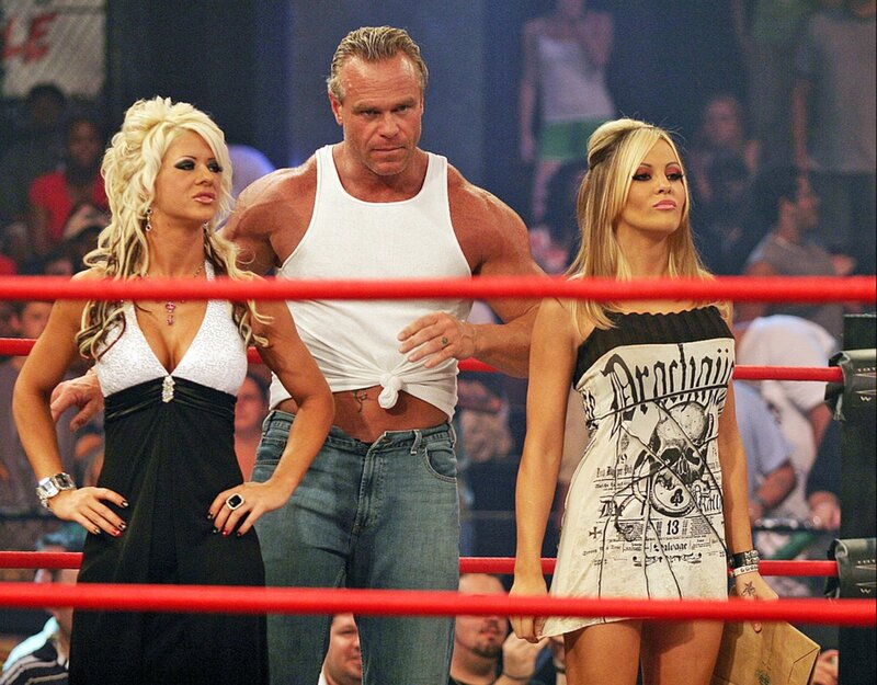 Wrestlers in ring with women