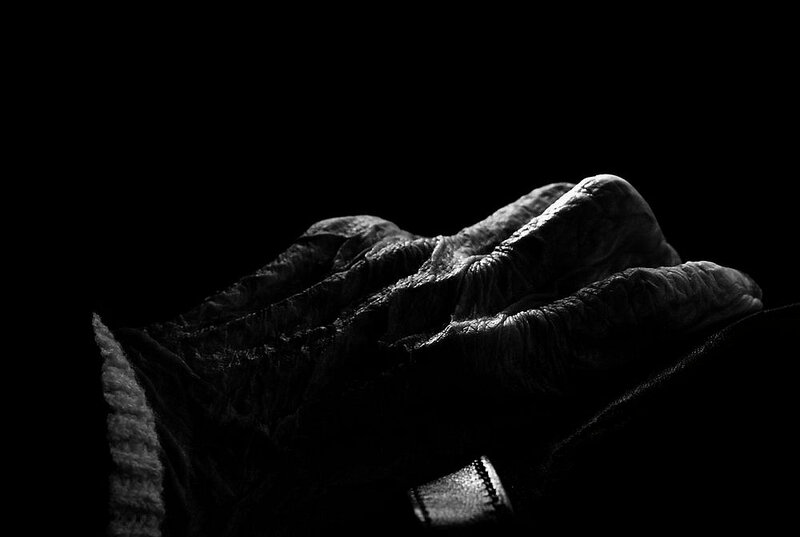 Wrinkled Hand in Shadow