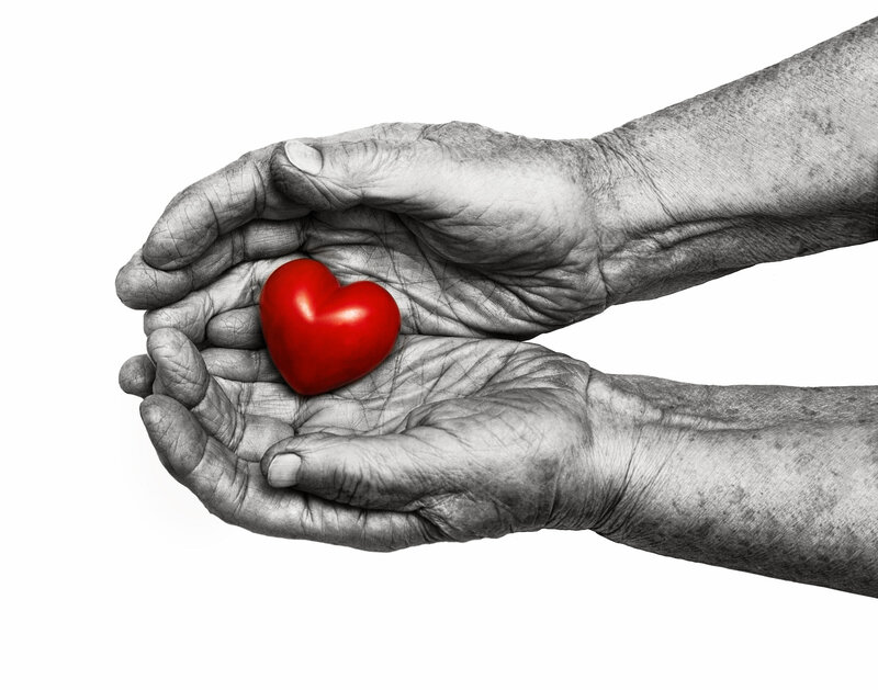 Wrinkled Hands Holding Heart