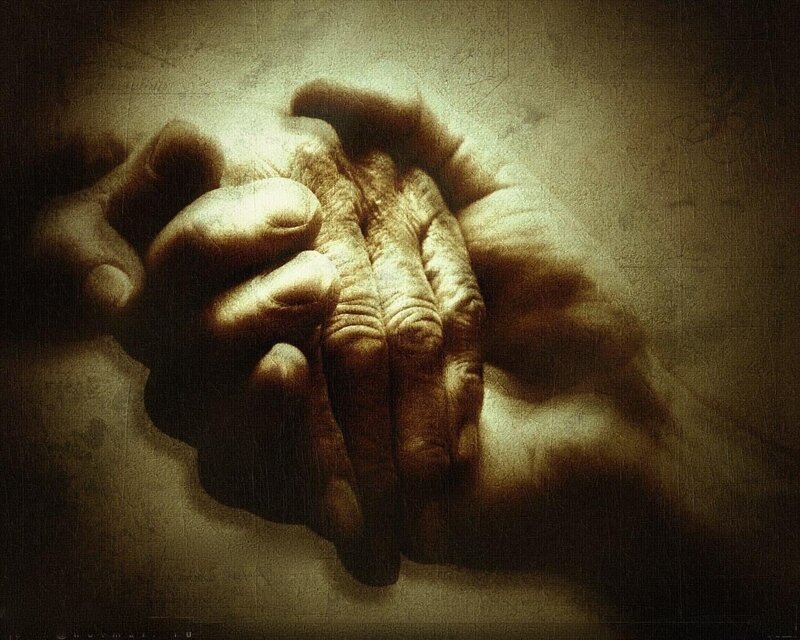 wrinkled hands in prayer