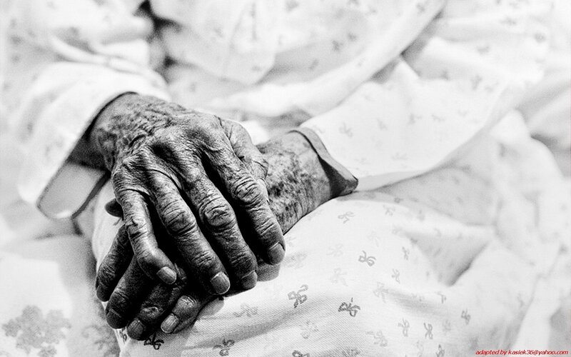 wrinkled hands of an elderly person