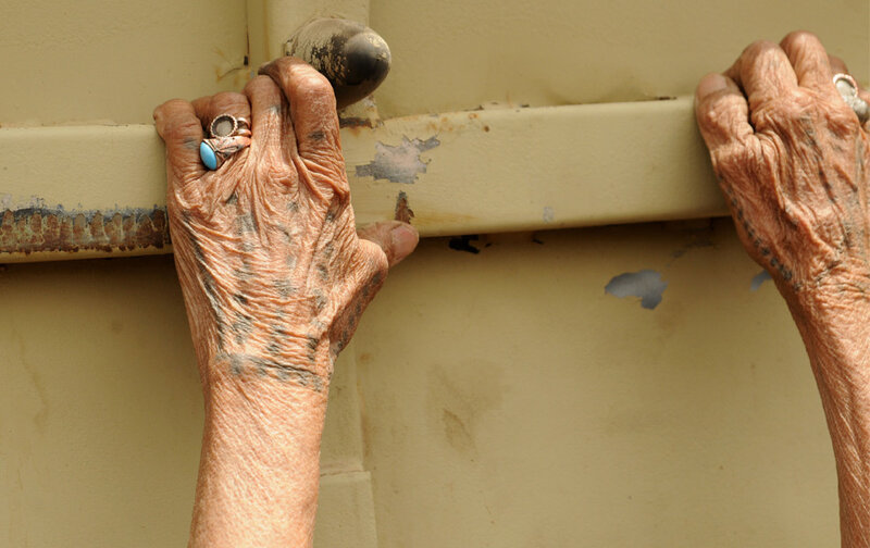 Wrinkled Hands on Railing
