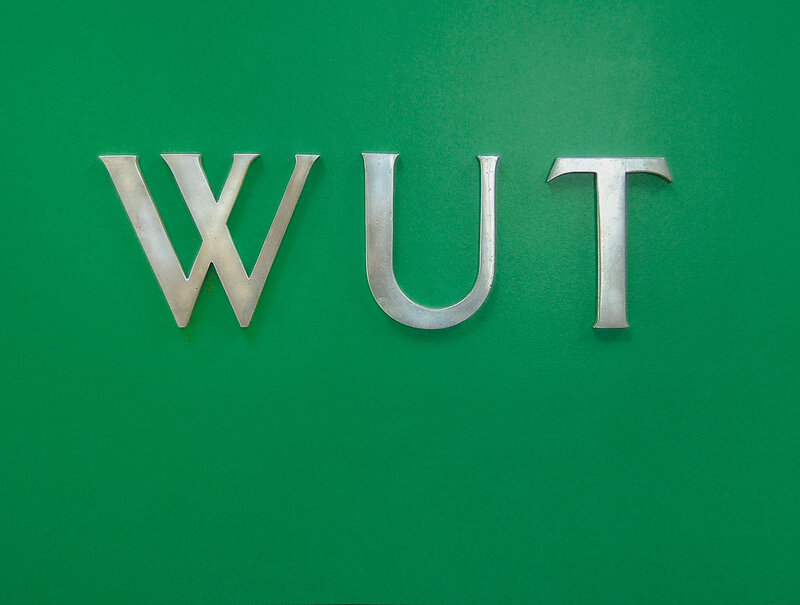 WUT letters on green background
