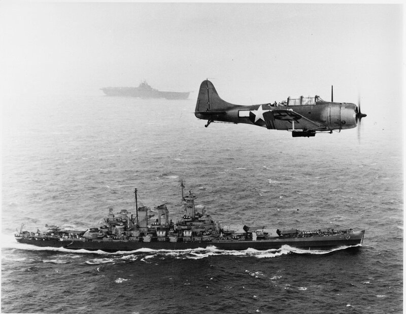 WWII aircraft over naval ships
