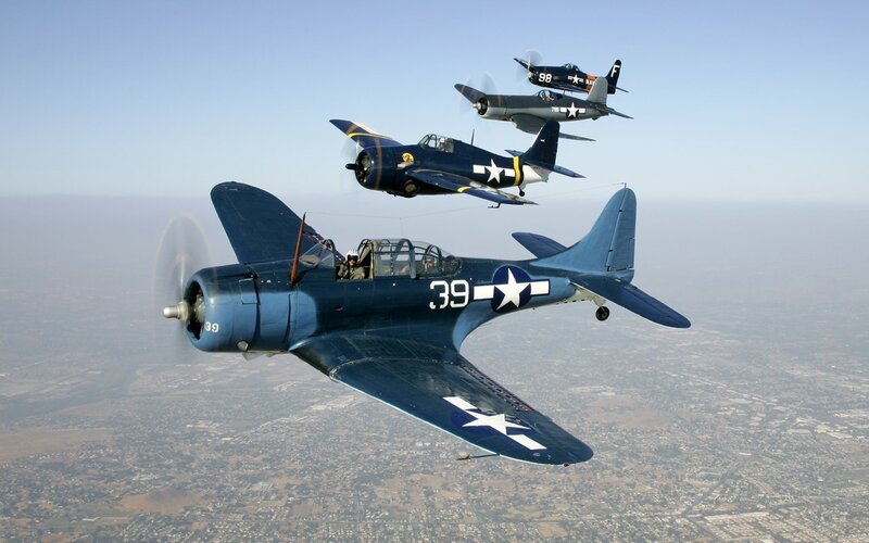 WWII-era aircraft in formation