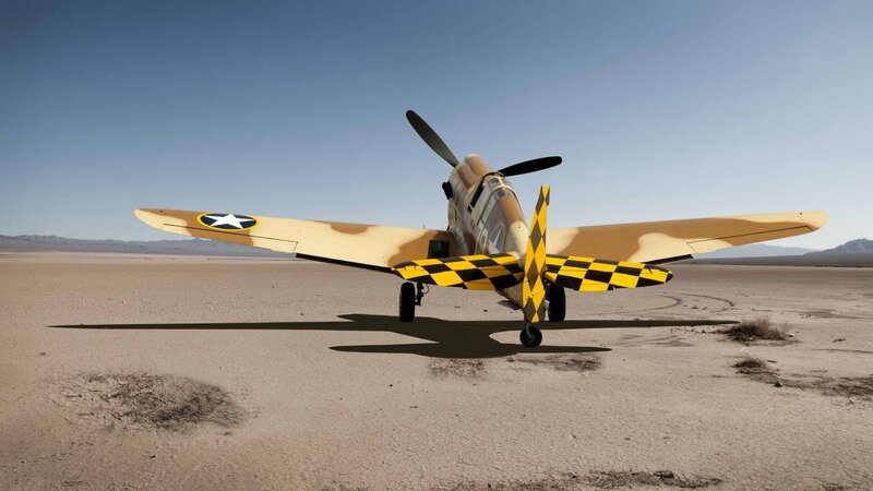 WWII-era fighter plane in desert