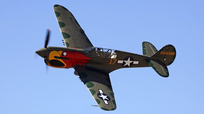 WWII-era fighter plane in flight