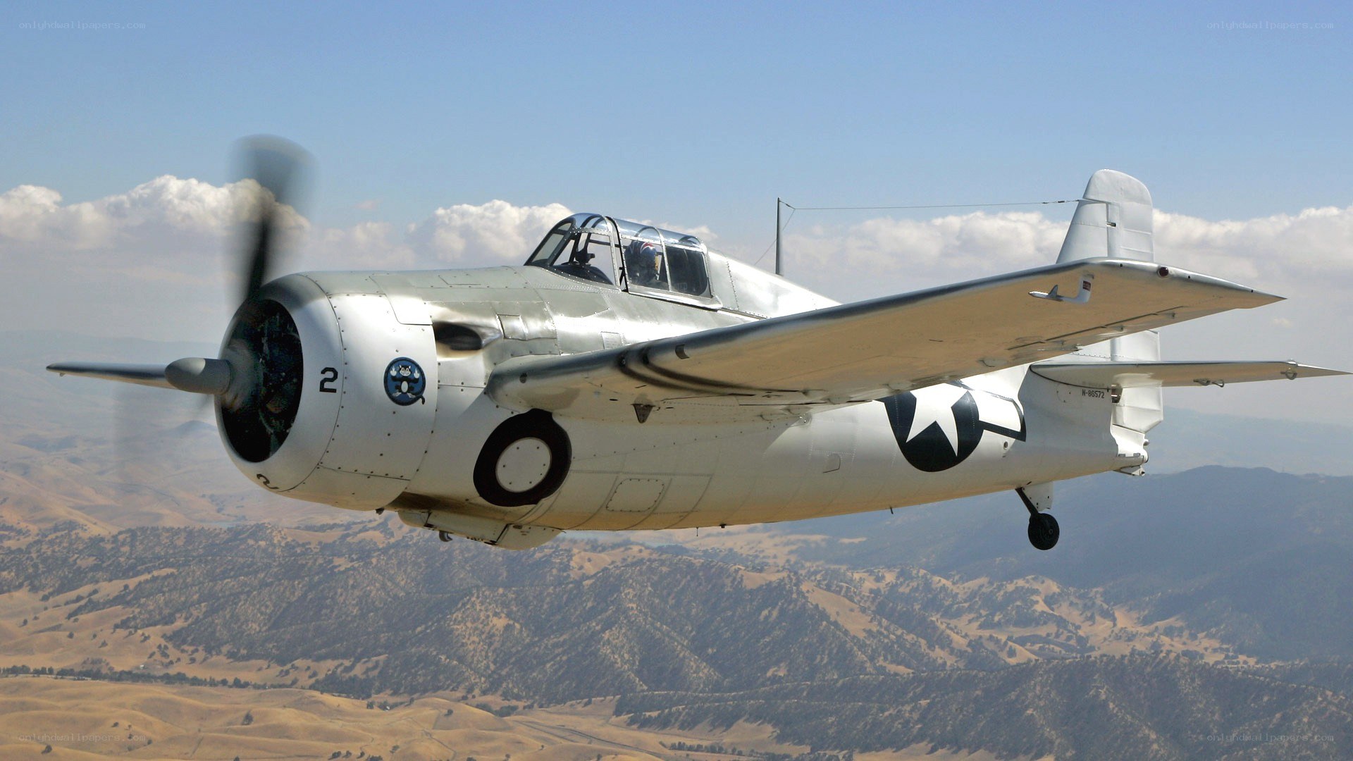 WWII-era fighter plane in flight