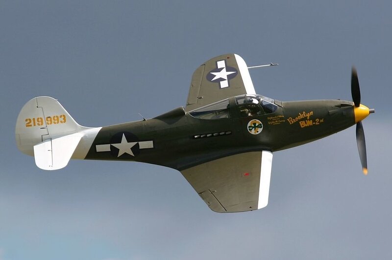 WWII-era fighter plane in flight