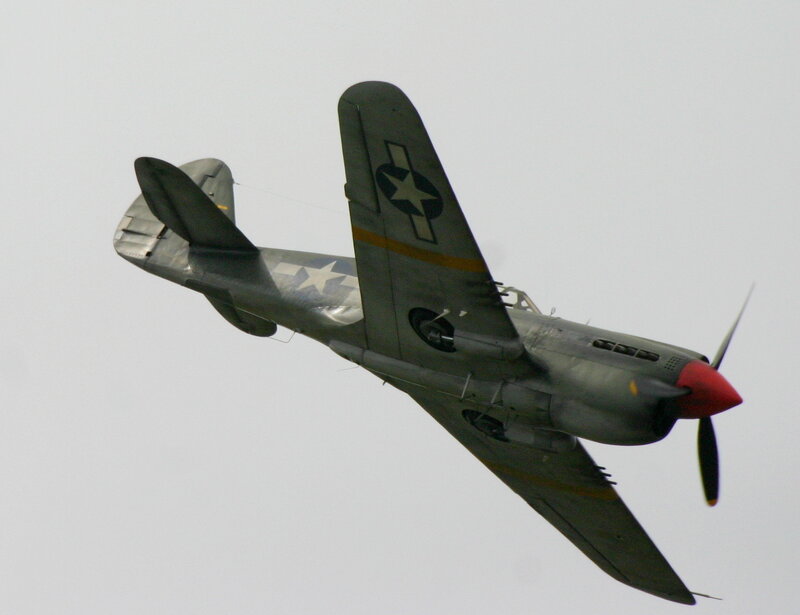 WWII-era fighter plane in flight