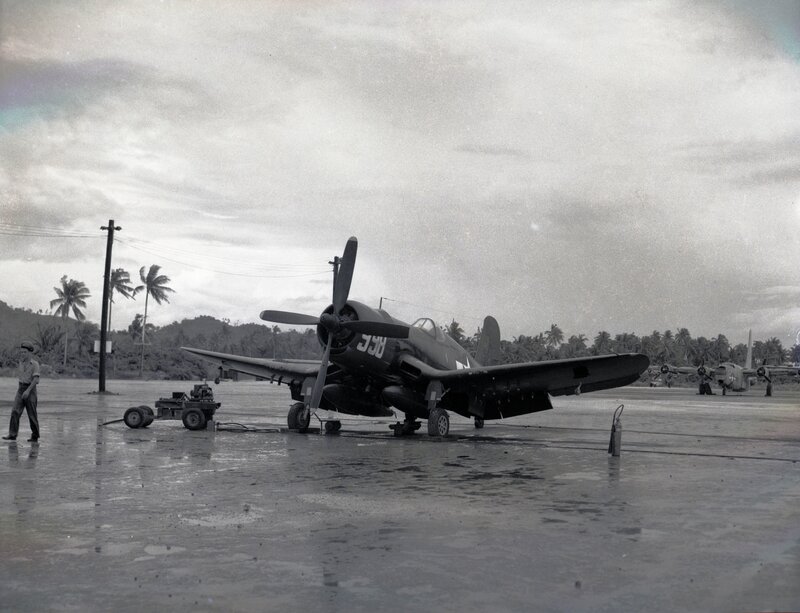 WWII-era fighter plane on airfield
