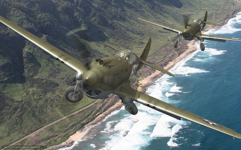 WWII fighter planes over coast
