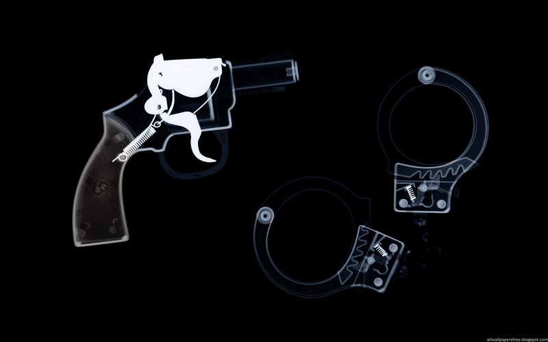X-ray of gun and handcuffs