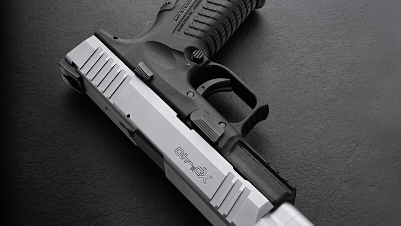 XDM pistol on dark surface