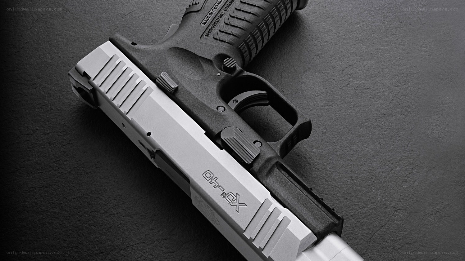 XDM pistol on dark surface