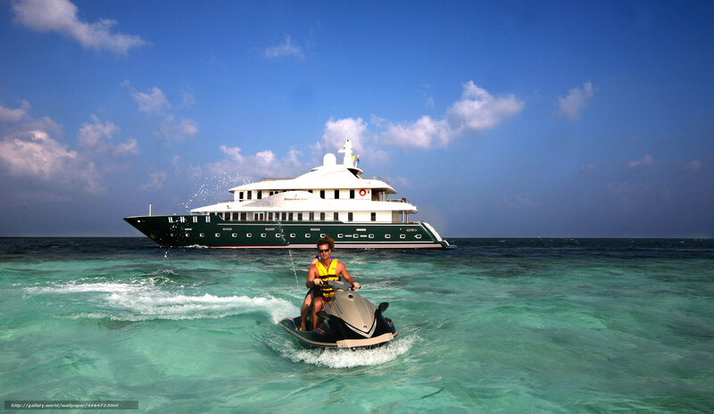 Yacht and jet ski in turquoise water