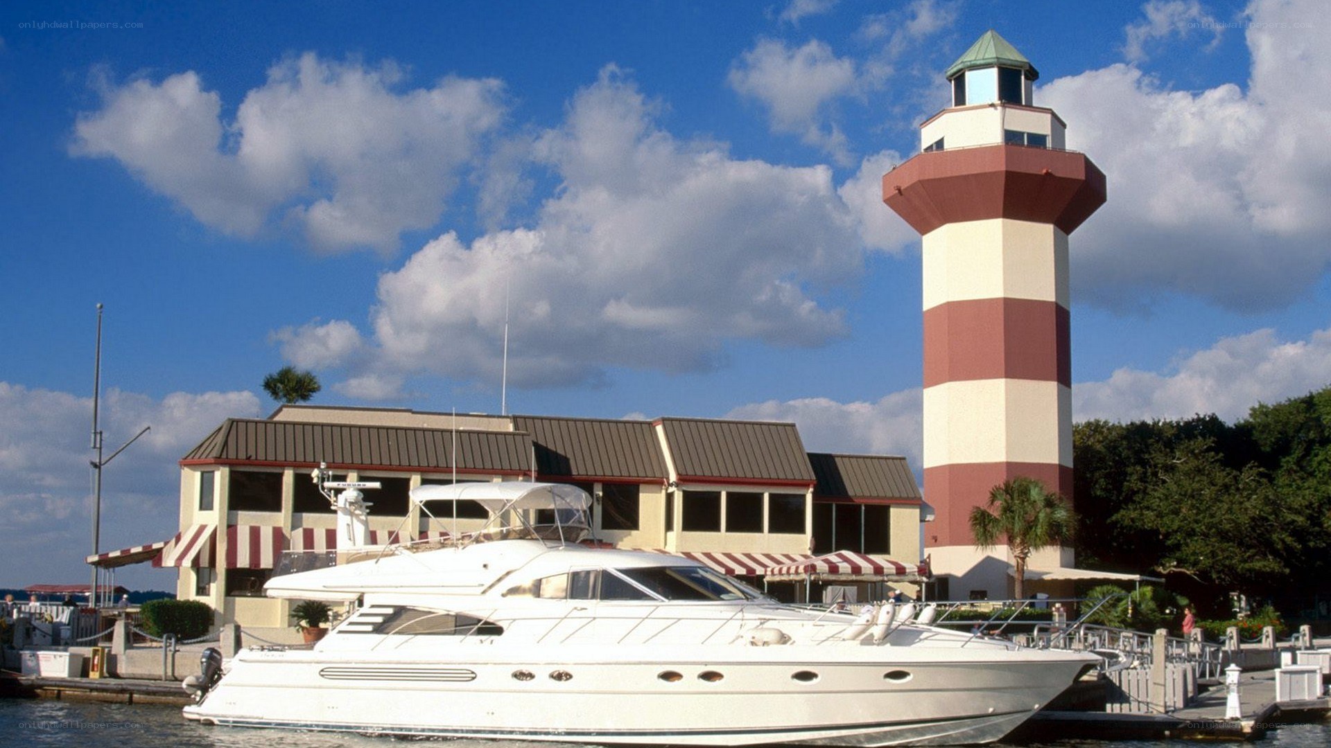 Yacht at lighthouse marina