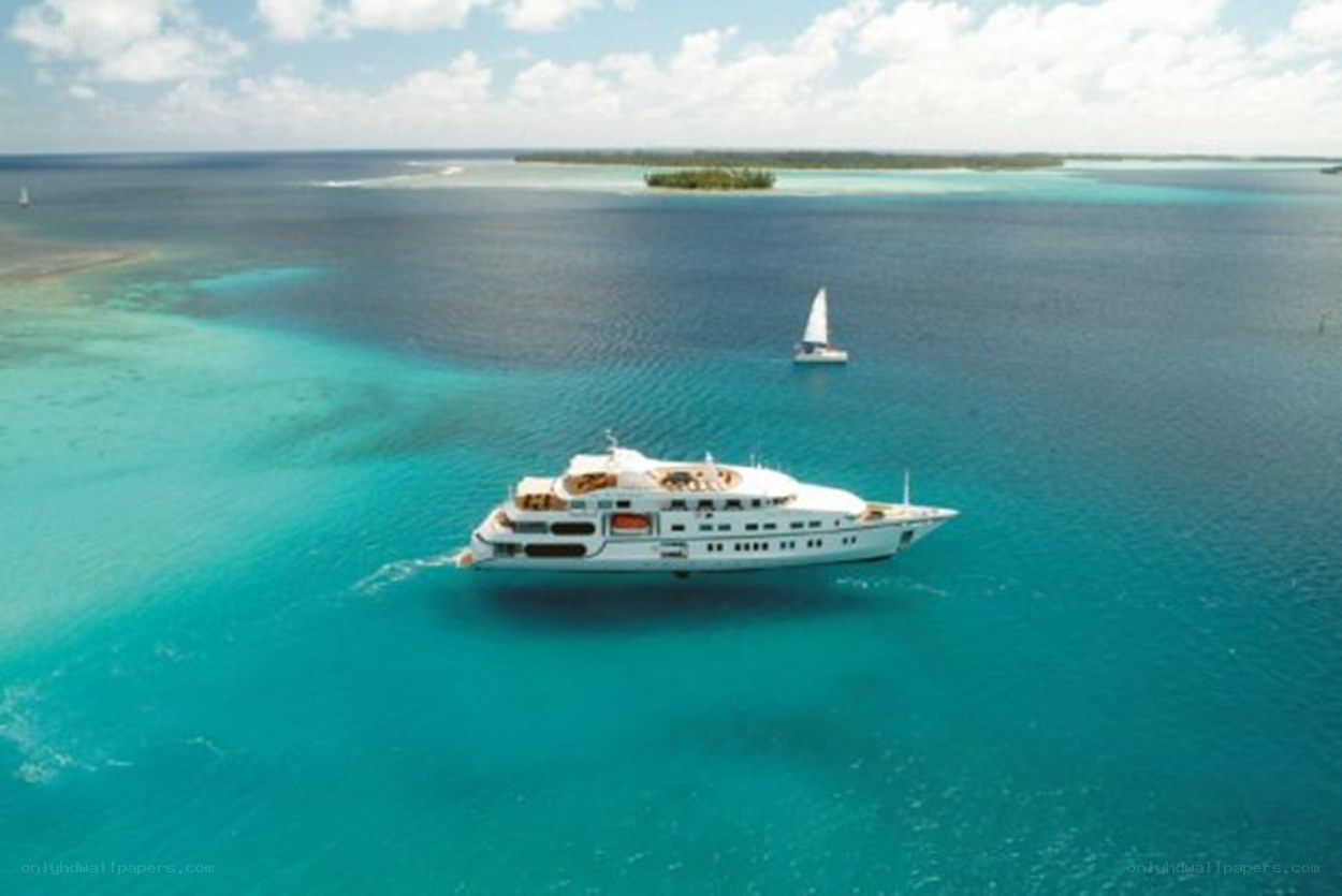 Yacht in turquoise lagoon