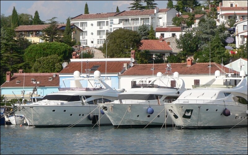 Yachts docked in a coastal town